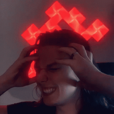 Person With Red Cross On Head Smiling GIF