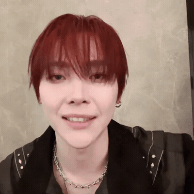 Person With Red Hair And Necklace GIF