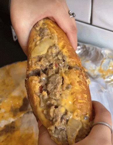 Person With Ring Holding Sandwich GIF