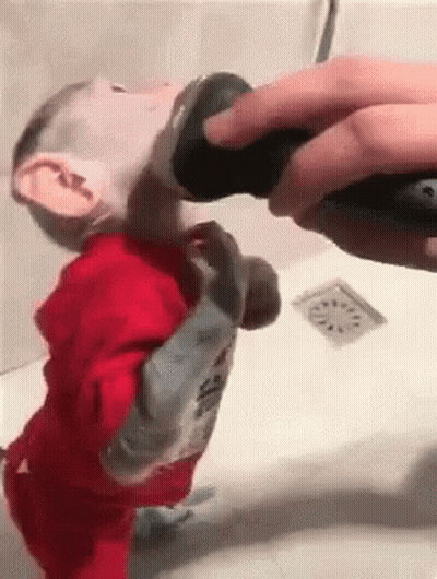 Person With Tattoo On Foot Next To Another Foot GIF