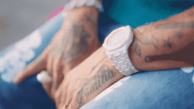 Person With Watch Saying Familia GIF