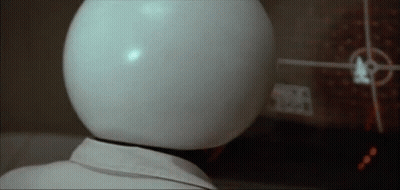 Person With White Helmet Looking At Screen GIF