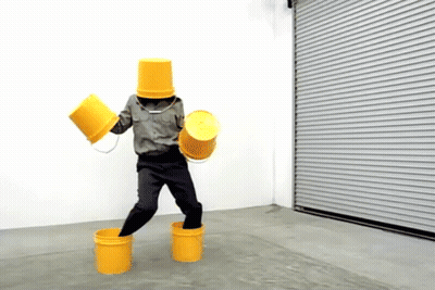 Person With Yellow Buckets On Head And Feet GIF