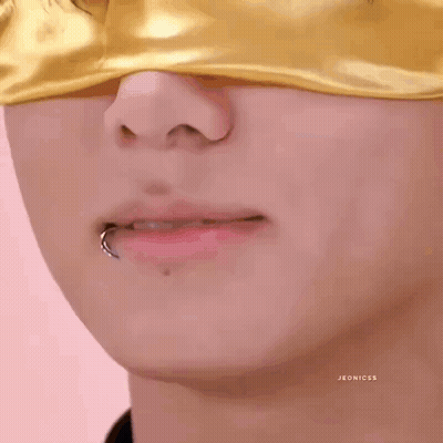 Person With Yellow Eye Mask And Lip Piercing GIF