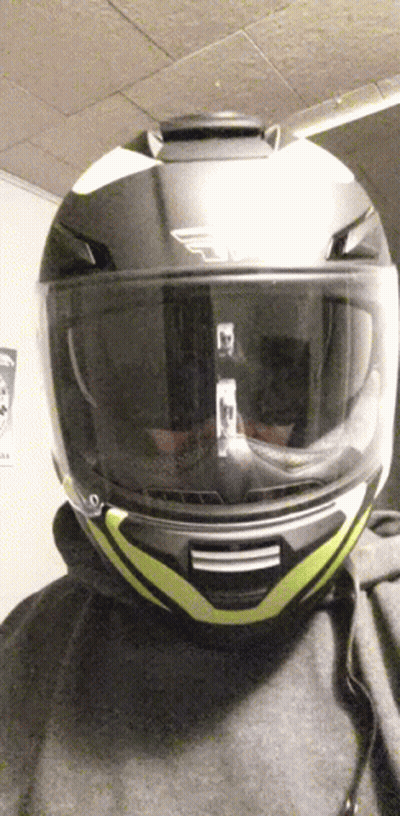 Person With Yellow-Striped Motorcycle Helmet GIF