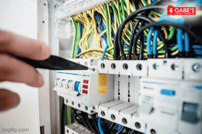Person Working On Electrical Box With Gabe's Electrical Service Logo GIF