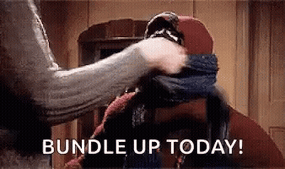 Person Wrapping Scarf Around Head Saying Bundle Up Today GIF