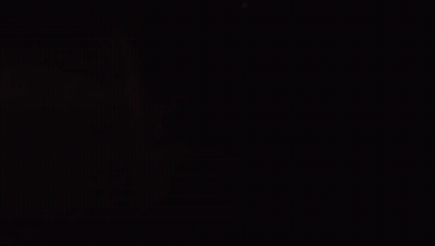 Person Writing On Paper In Dark GIF