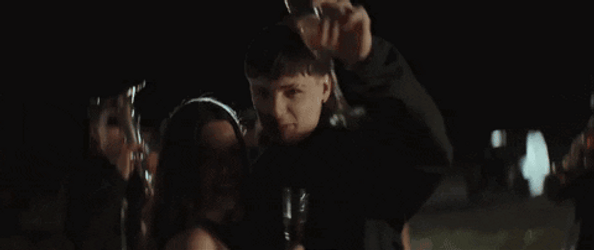 Peso Pluma And Nicki Nicole Drinking Champagne GIF