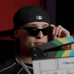 Peso Pluma Holding Sunglasses GIF