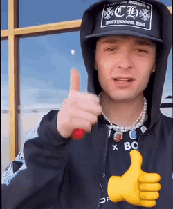 Peso Pluma On Hoodie With Thumbs Up Emoji GIF