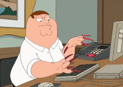 Peter Griffin From Family Guy Is Sitting At A Desk Typing On A Keyboard GIF