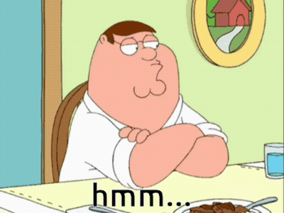 Peter Griffin From Family Guy Is Sitting At A Table With A Plate Of Food GIF