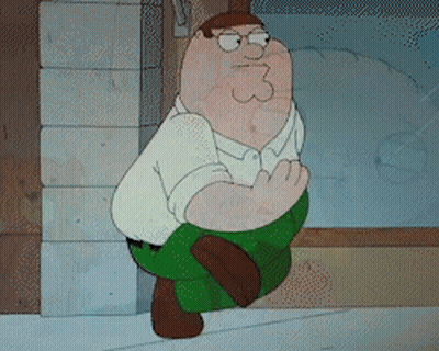 Peter Griffin From Family Guy Is Sitting Down With His Hands Folded GIF