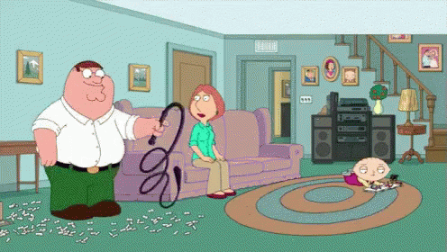 Peter Griffin Is Holding A Whip In His Hand While Lois Griffin Sits On A Couch GIF