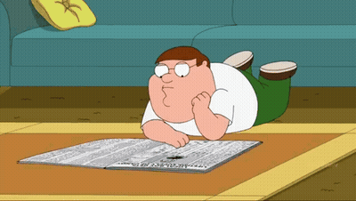 Peter Griffin Is Reading A Newspaper On The Floor GIF