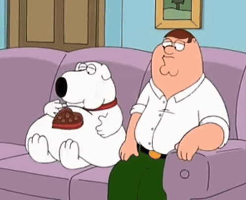 Peter Griffin Sits On Couch Next To Cartoon Dog GIF