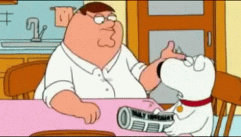 Peter Griffin Sitting At Table With Dog Holding Newspaper GIF