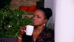 Phaedra Holding A White Mug GIF