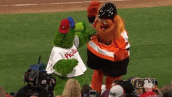 Phanatic Green And Orange Mascots Dance Showdown GIF