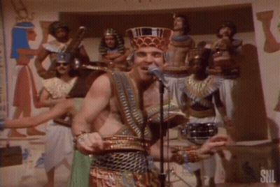 Pharaoh Costume Man Singing Into Microphone GIF
