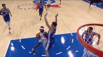 Philadelphia Basketball Player Shooting Over Defender GIF