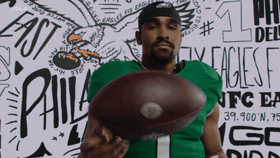 Philadelphia Eagles Player Holding Football GIF