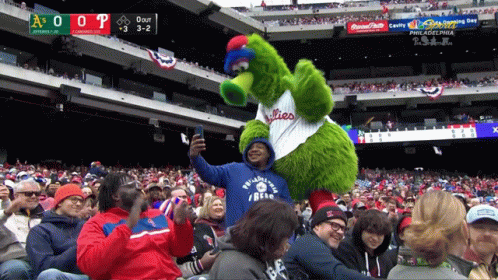 Philadelphia Phillies Mascot Taking Picture of Fan