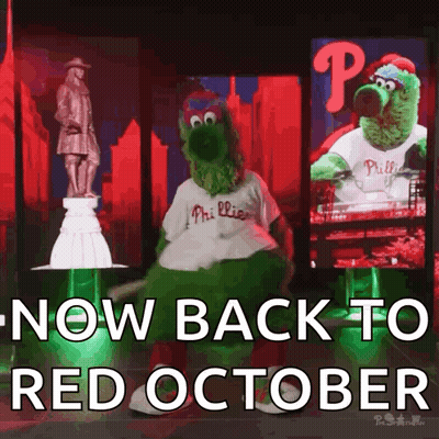 Phillies Mascot Dancing in Front of Statue Saying Now Back to Red October