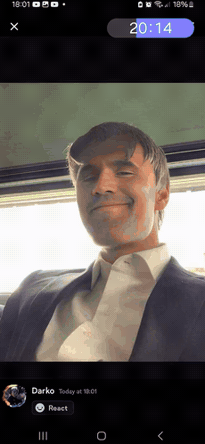 Phone Screen Showing Man In Suit And Tie At 20:14 GIF