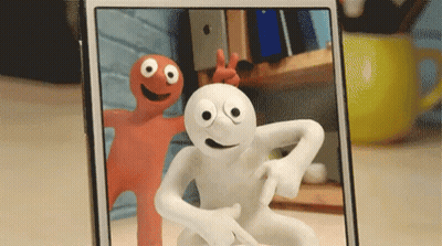 Phone With Two Cartoon Characters One Big Eyes GIF