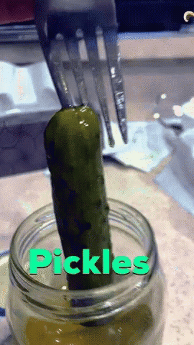 Pickle Being Pulled Out Of Jar Labeled Pickles GIF