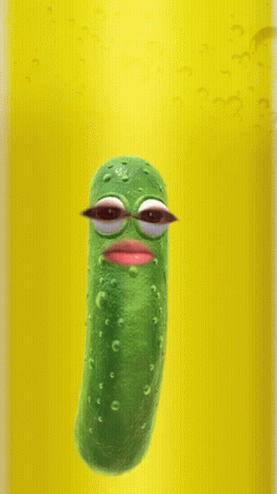 Pickle With Big Eyes Floating In Yellow Liquid GIF