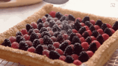 Pie With Raspberries Blackberries And Powdered Sugar GIF