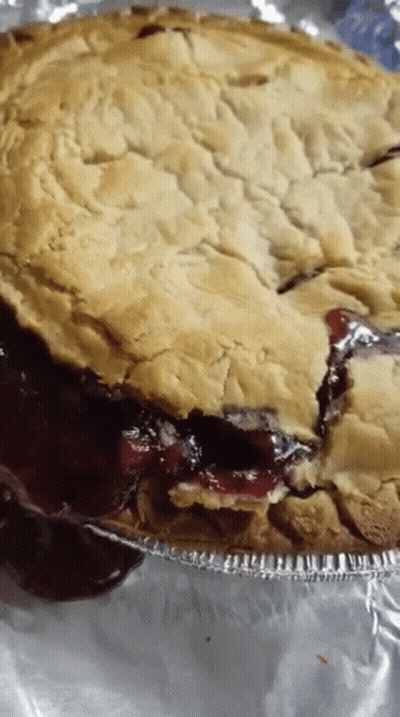Pie With Slice Taken Out On Foil GIF