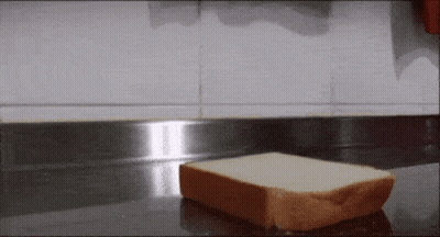 Piece Of Bread On Counter GIF