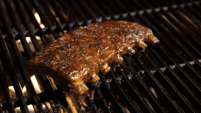 Piece Of Meat Cooking On Grill With Flames GIF