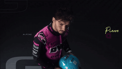 Pierre Gasly Is Holding A Blue Helmet In His Hands GIF