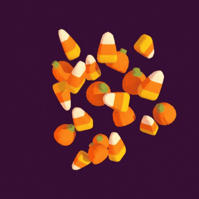 Pile Of Candy Corn Pumpkins On Dark Background GIF