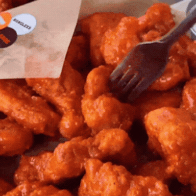 Pile Of Chicken Nuggets With Fork GIF