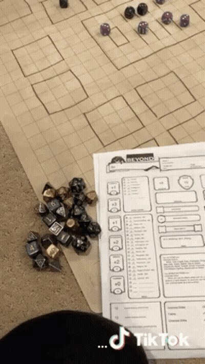 Pile Of Dice Beside Paper Saying Beyond GIF