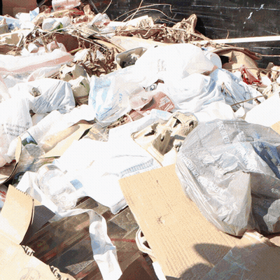 Pile Of Garbage With Recycling Bag GIF