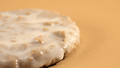 Pile Of Oats Next To Donut GIF