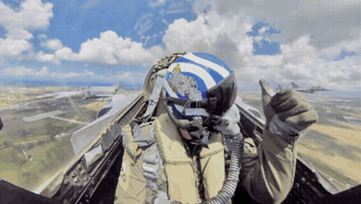 Pilot In Blue And White Helmet With Greek Flag Thumbs Up GIF