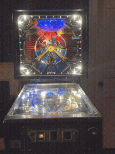 Pinball Machine With Face And Number 0 GIF