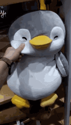 Pinching Penguin Toy Cheek GIF