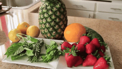 Pineapple Next To Strawberries Lemons And Other Fruits GIF