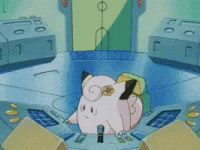Pink Cartoon Character Sitting On Table With Yellow Flower GIF