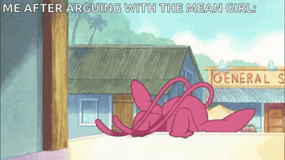 Pink Cartoon Laying on Ledge in Front of General Store