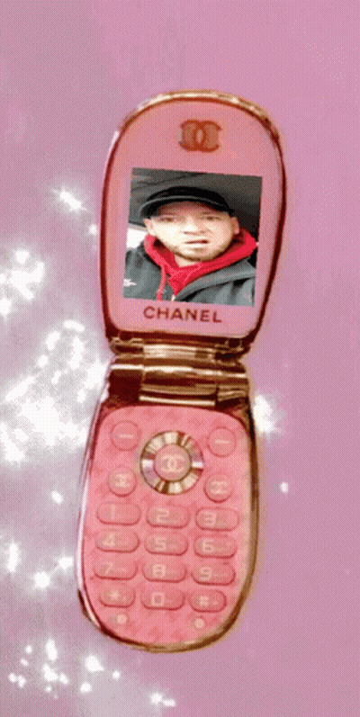Pink Chanel Flip Phone On Pink Background GIF